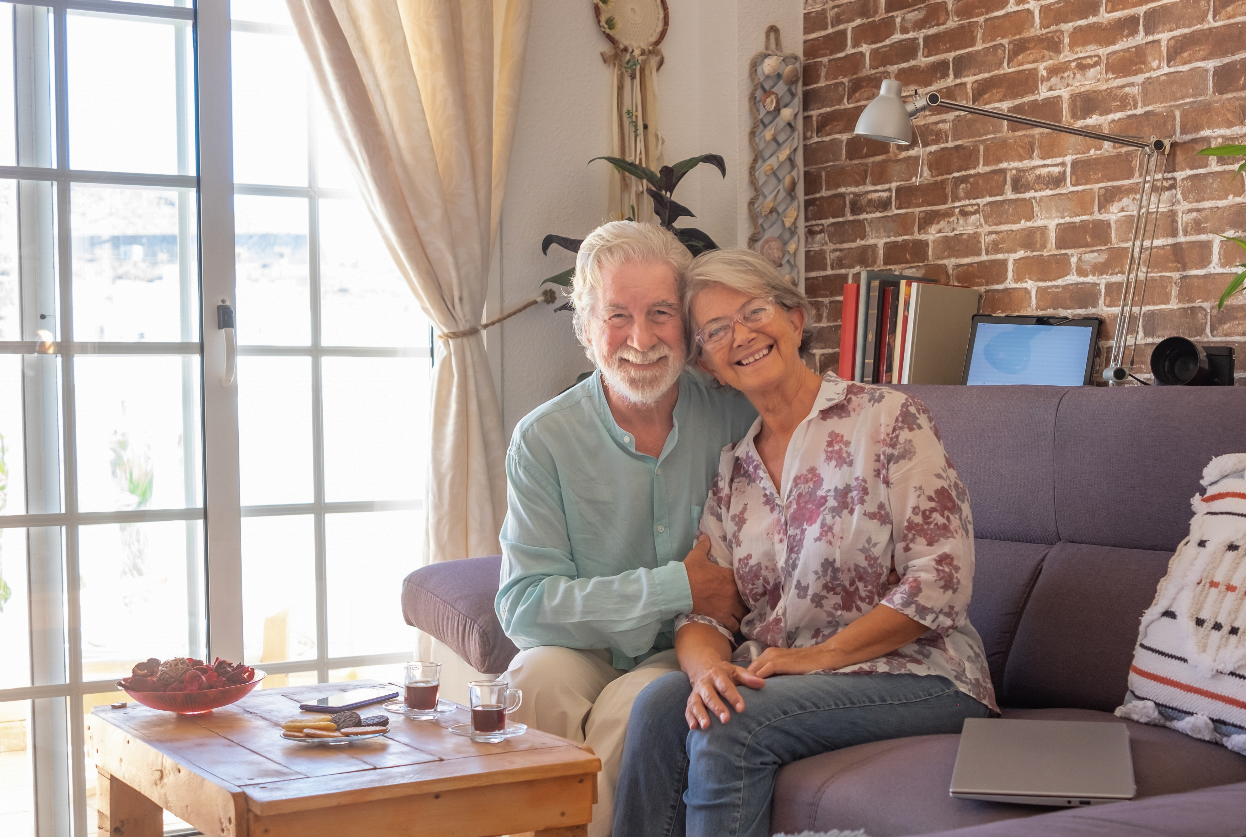 A smiling senior couple relaxing together at home